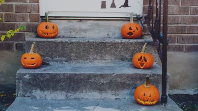 carved pumpkins on porch