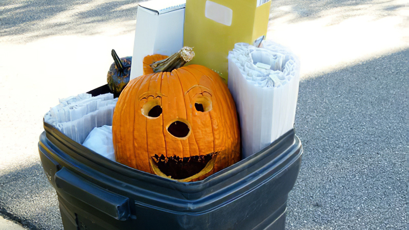 pumpkin in trash can